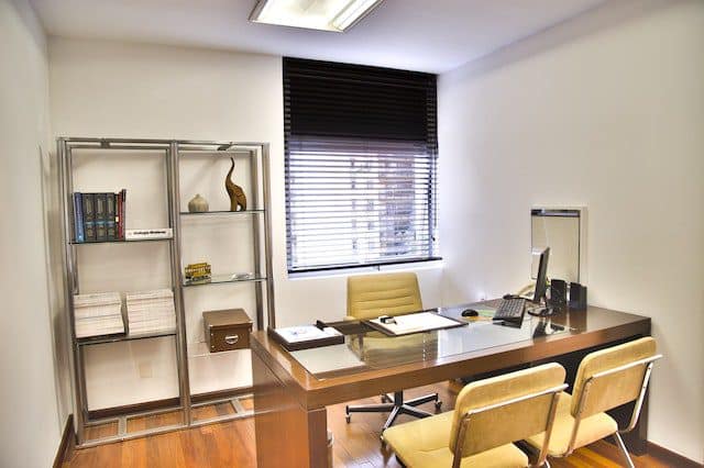 Black blind in office space